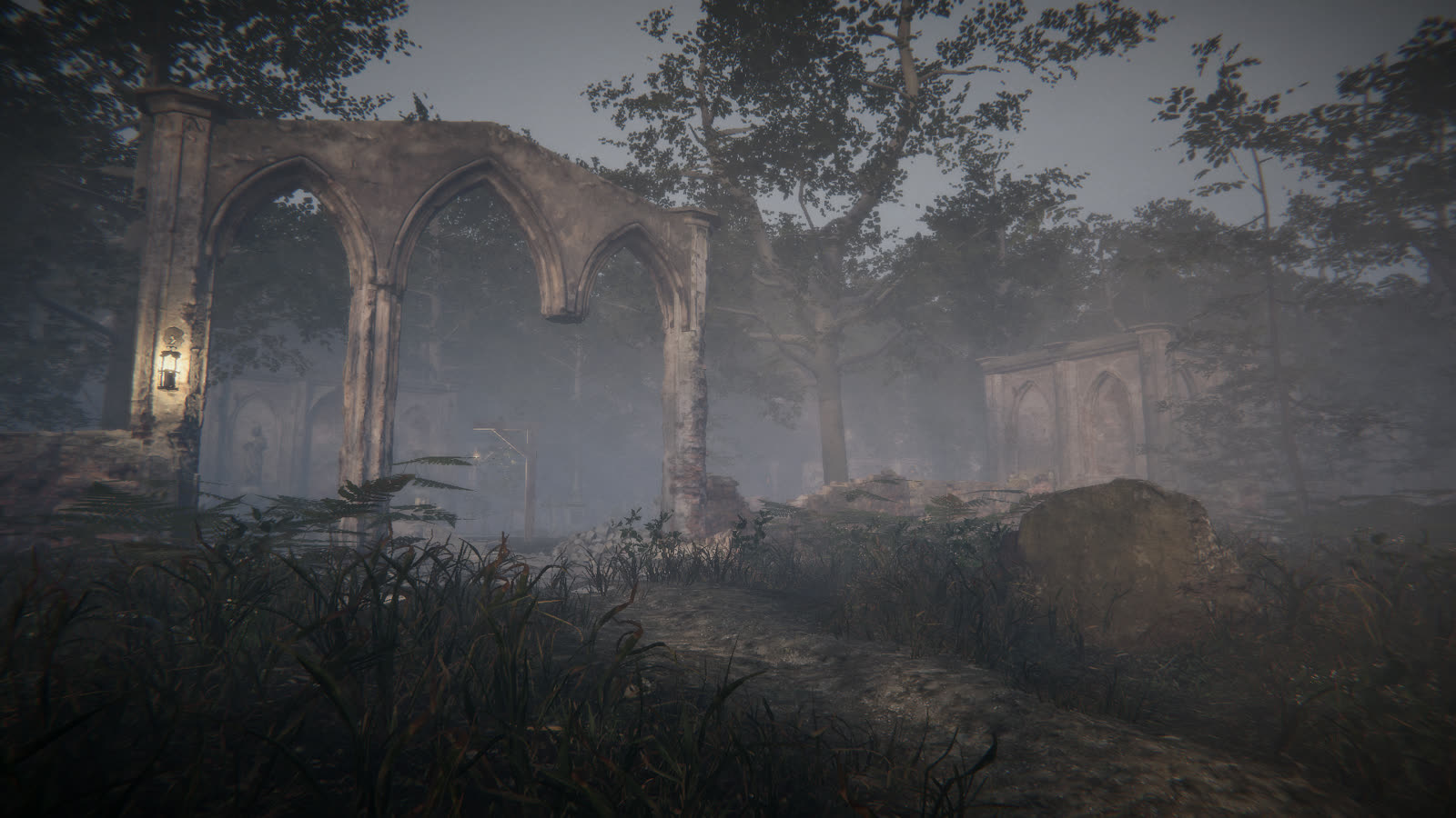 Ruined stone arches in the fog